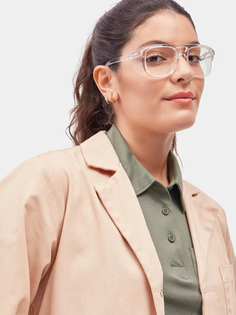 Model wearing clear Stoggles aviator frames, showing the double-bridge design and side shield fit.