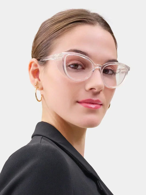 Female model wearing Stoggles cat-eye glasses against a grey background.
