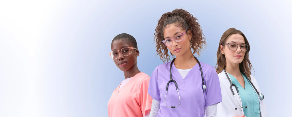  Three smiling healthcare workers in colorful scrubs and stethoscopes wearing Stoggles stand together against a blue background.