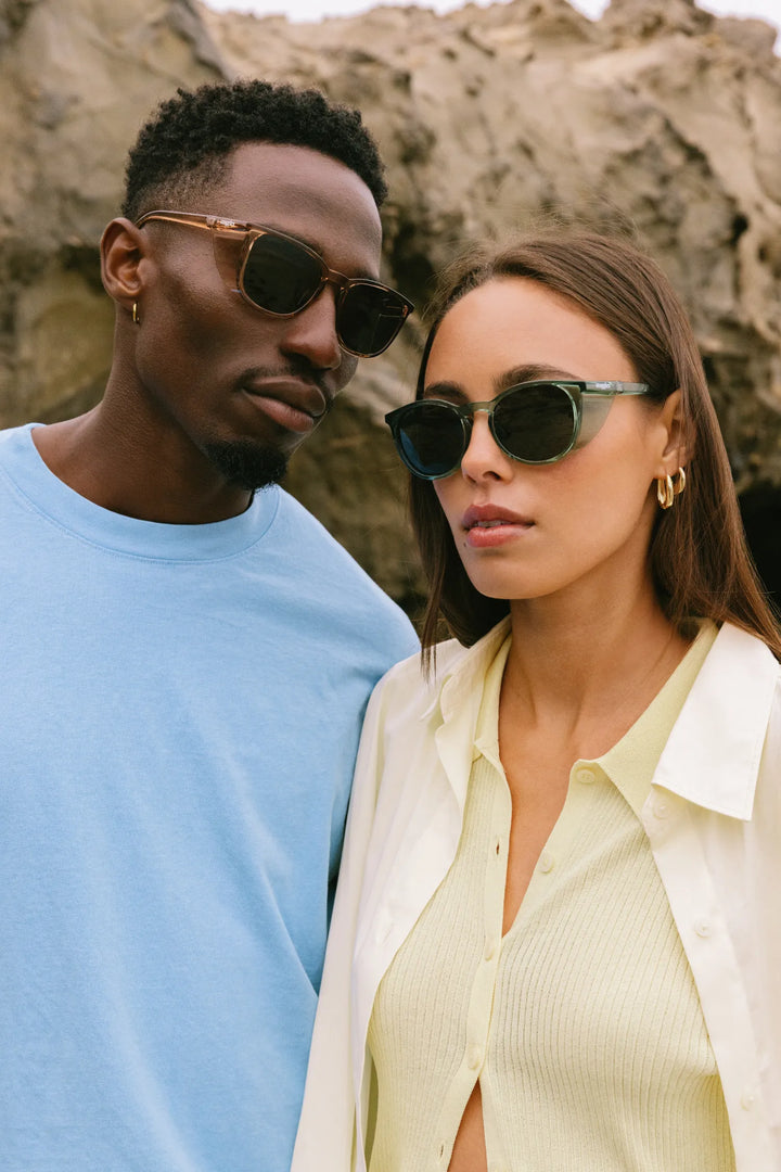 Male and female models wearing SunStoggles looking at camera